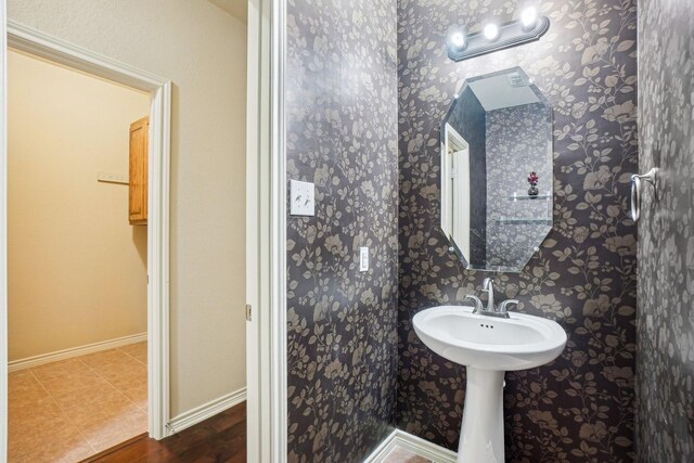 bathroom with tile patterned floors and baseboards