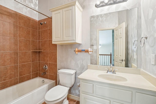 full bathroom featuring toilet, bathtub / shower combination, and vanity