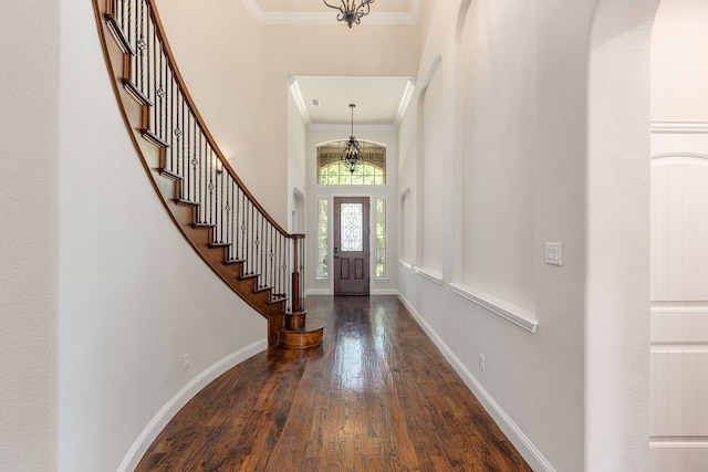 141 Claremont Dr, Ovilla, TX 75154 - entryway featuring a chandelier, crown molding, wood finished floors, stairway, and baseboards