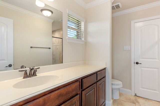 141 Claremont Dr, Ovilla, TX 75154 - full bath with crown molding, toilet, vanity, tile patterned floors, and baseboards
