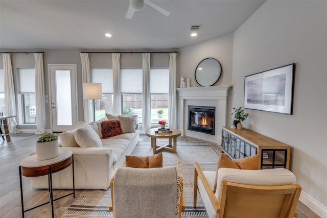 4009 Palomino Rd, Aubrey, TX 76227 - living room featuring a fireplace, healthy amount of natural light, a ceiling fan, baseboards, and recessed lighting