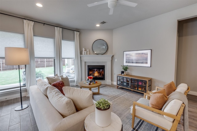 4009 Palomino Rd, Aubrey, TX 76227 - living room with ceiling fan, a premium fireplace, baseboards, recessed lighting, and wood finished floors