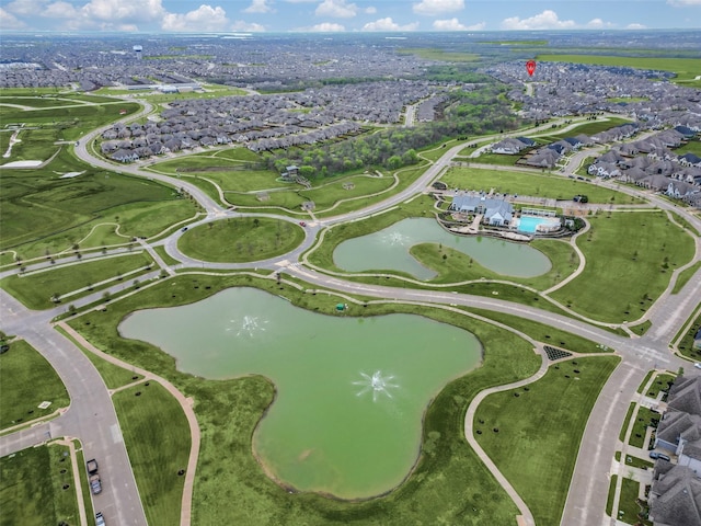drone / aerial view featuring a residential view and a water view
