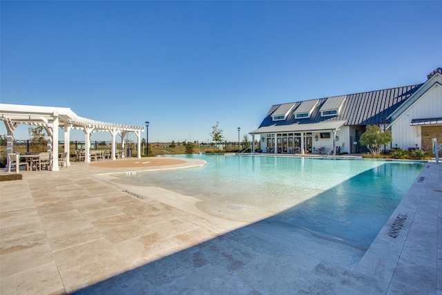 community pool with a pergola and a patio