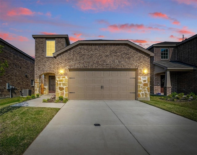 849 Breakwater Dr, Princeton, TX 75407 - view of front facade with concrete driveway, stone siding, and brick siding
