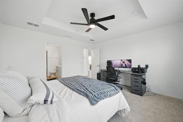 849 Breakwater Dr, Princeton, TX 75407 - bedroom featuring a ceiling fan, visible vents, light carpet, and a tray ceiling