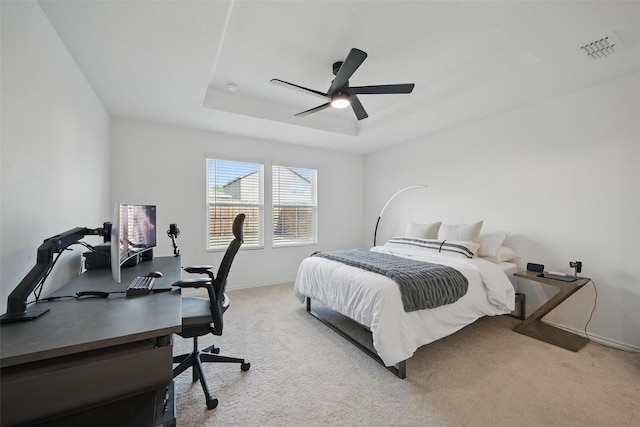 849 Breakwater Dr, Princeton, TX 75407 - carpeted bedroom with baseboards, visible vents, ceiling fan, and a tray ceiling