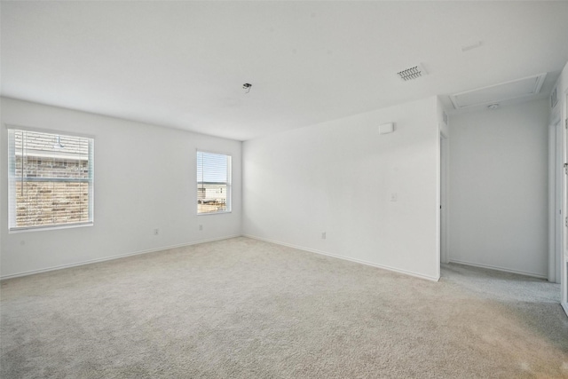 849 Breakwater Dr, Princeton, TX 75407 - spare room with attic access, visible vents, light carpet, and baseboards
