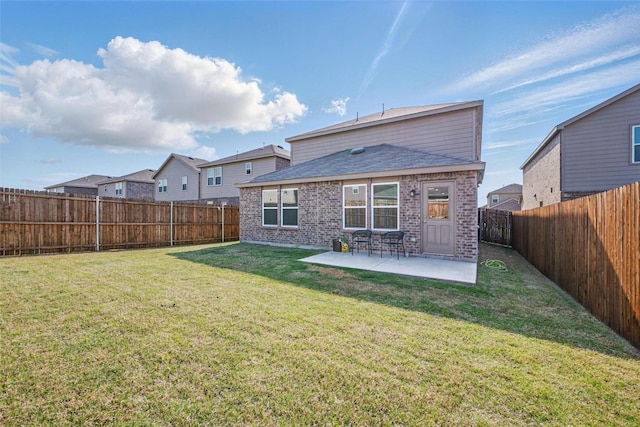 849 Breakwater Dr, Princeton, TX 75407 - back of house featuring a yard, a patio, brick siding, and a fenced backyard