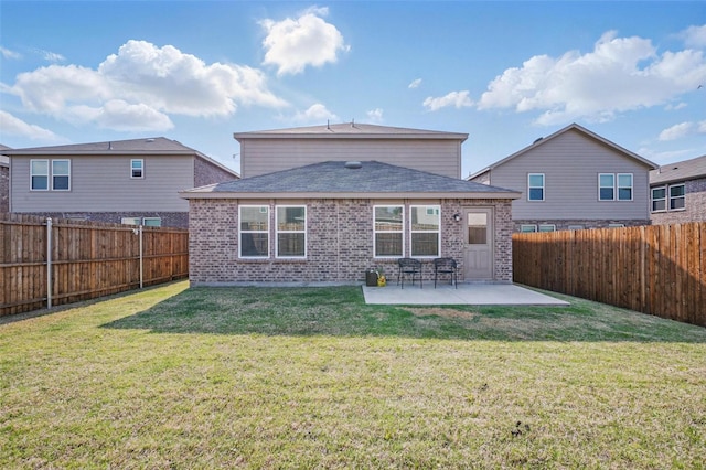 849 Breakwater Dr, Princeton, TX 75407 - back of house featuring a patio, brick siding, a fenced backyard, and a yard