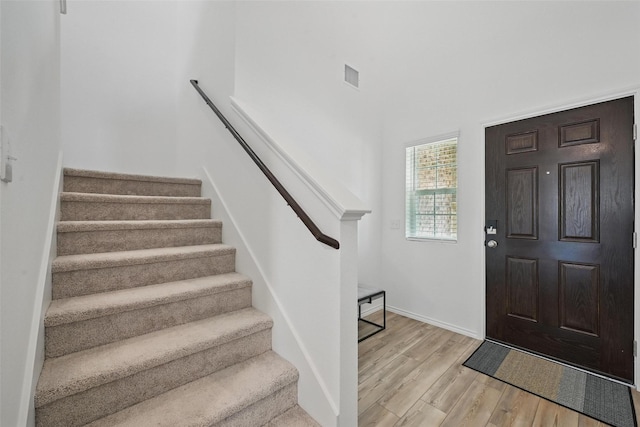 849 Breakwater Dr, Princeton, TX 75407 - entrance foyer with visible vents, stairway, wood finished floors, and baseboards