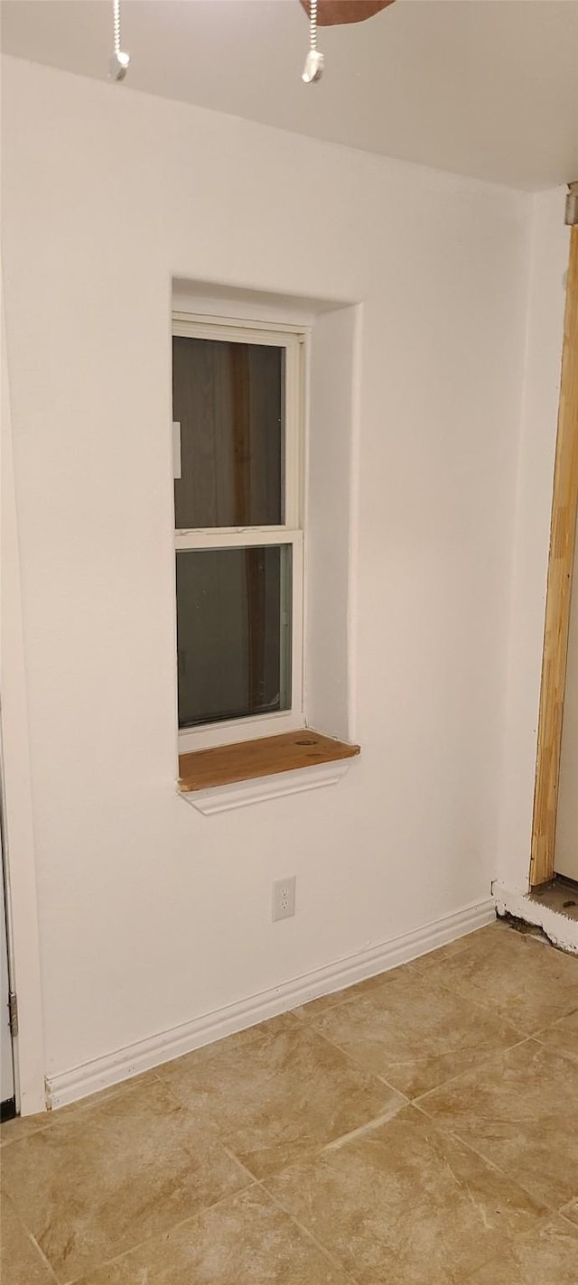 empty room with baseboards