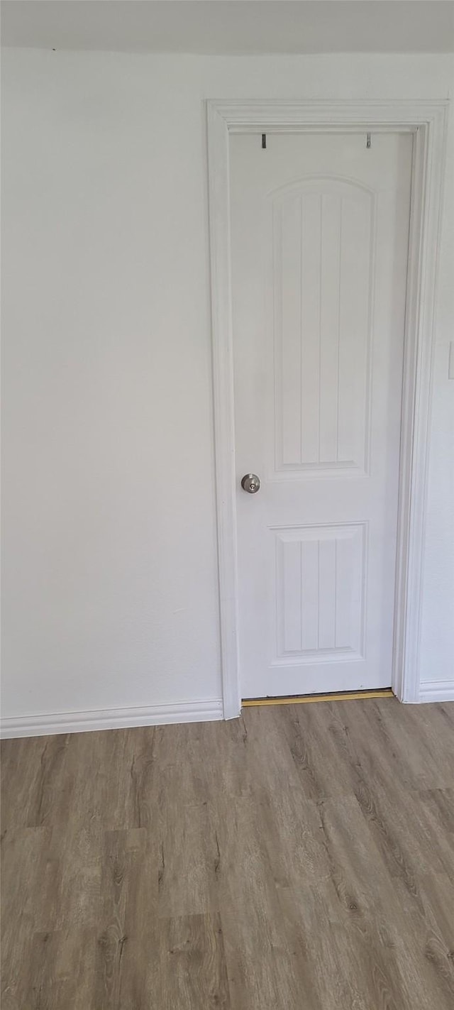 room details featuring wood finished floors and baseboards