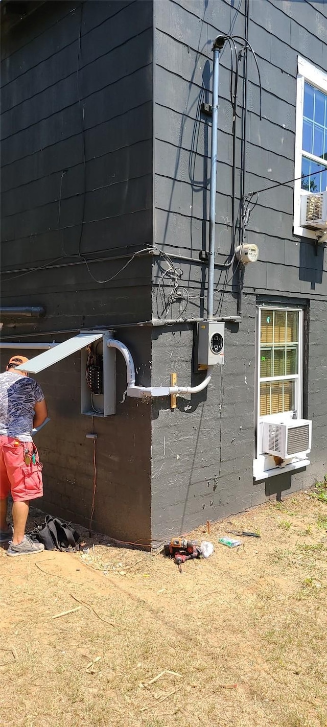 view of side of home with cooling unit