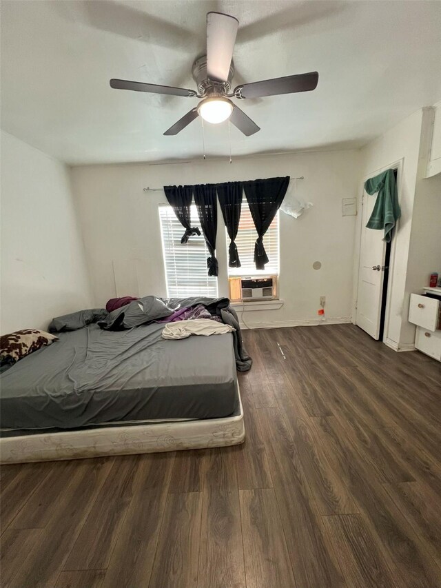 bedroom with wood finished floors and ceiling fan