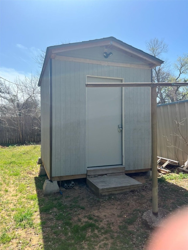 view of shed with fence