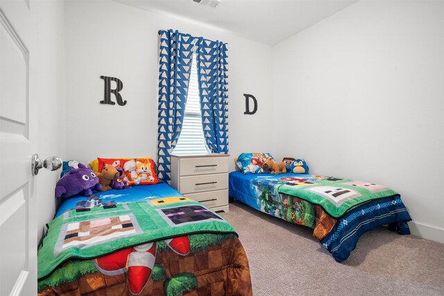 bedroom featuring visible vents and carpet floors