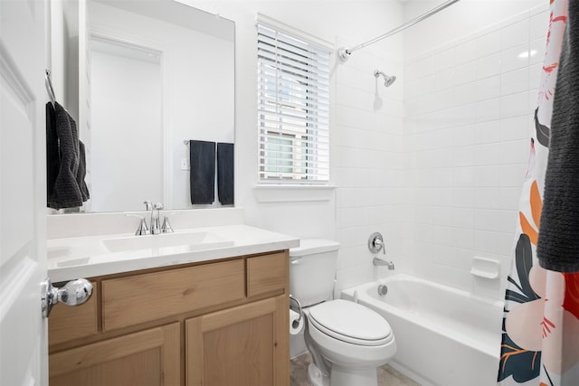 bathroom featuring toilet, vanity, and shower / bath combination with curtain