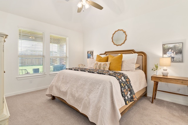 bedroom with baseboards, ceiling fan, and carpet floors