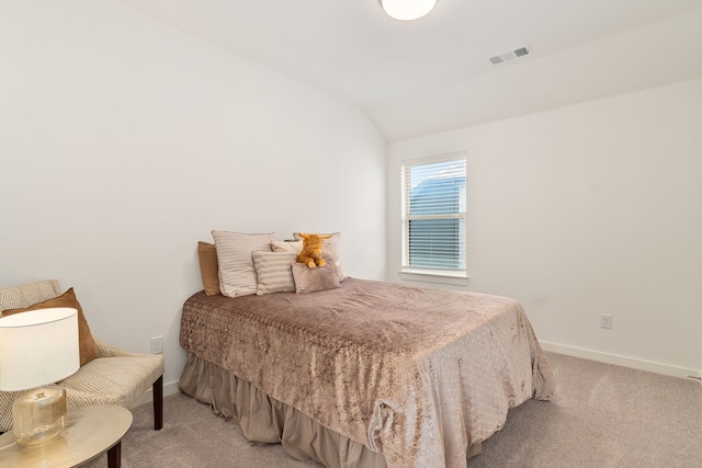 bedroom featuring light colored carpet, visible vents, and baseboards
