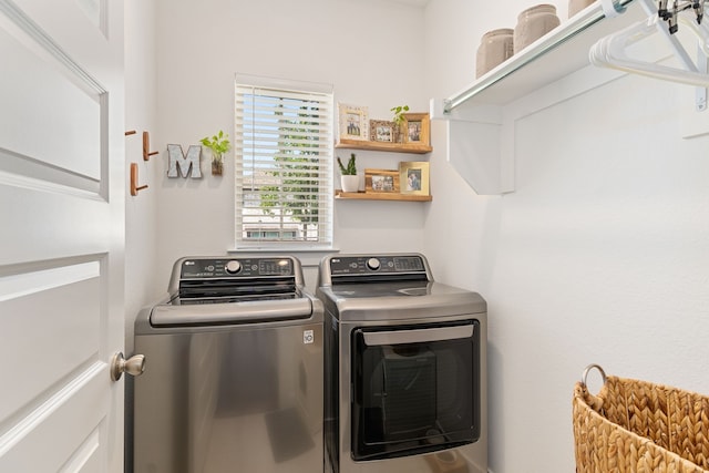 laundry room featuring washing machine and clothes dryer and laundry area