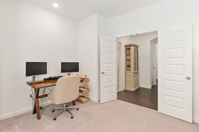 office featuring recessed lighting, carpet flooring, arched walkways, and baseboards