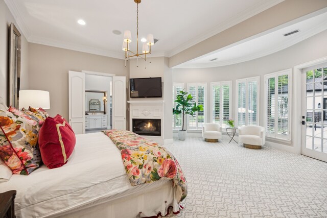 bedroom featuring visible vents, crown molding, access to exterior, a lit fireplace, and carpet flooring
