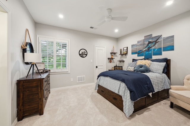 bedroom with baseboards, light carpet, recessed lighting, and visible vents