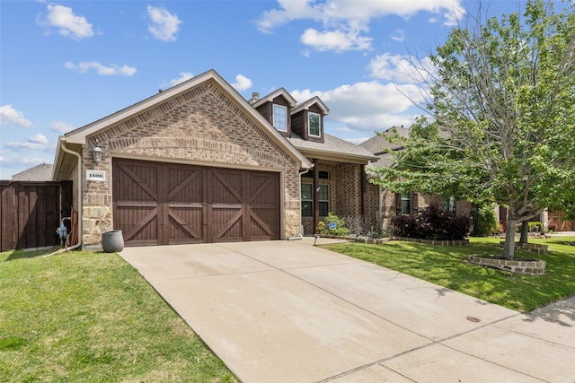 view of front facade with brick siding, fence, a garage, driveway, and a front lawn