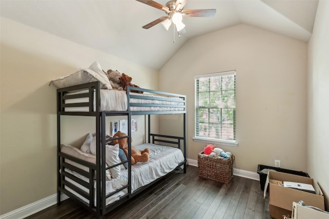 bedroom with baseboards, hardwood / wood-style flooring, a ceiling fan, and vaulted ceiling