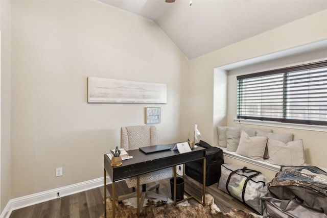 office space with lofted ceiling, wood finished floors, and baseboards