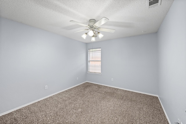 spare room featuring visible vents, ceiling fan, carpet floors, and baseboards