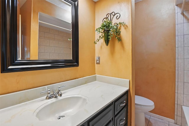 bathroom with toilet, vanity, a shower, and tile patterned floors