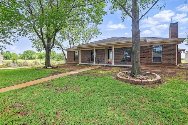 1018 Meridith Dr, Terrell, TX 75160 - back of property with brick siding and a chimney