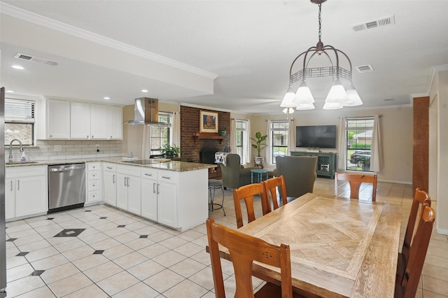 kitchen with visible vents, black electric cooktop, stainless steel dishwasher, and exhaust hood