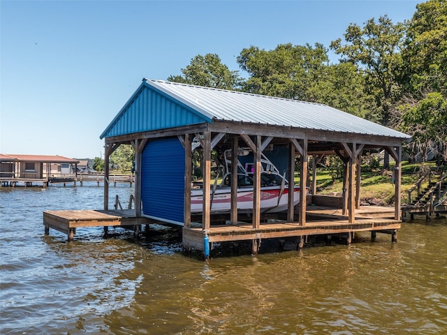 view of dock featuring a water view and boat lift
