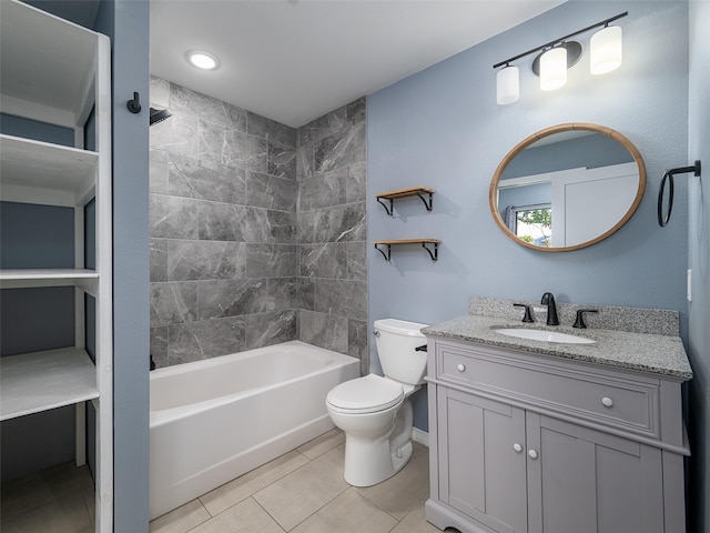 bathroom with tile patterned floors, bathing tub / shower combination, toilet, vanity, and baseboards