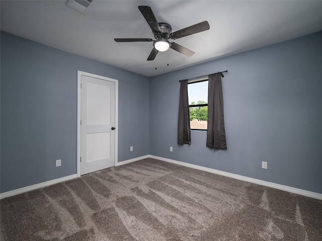 spare room with visible vents, ceiling fan, baseboards, and carpet floors