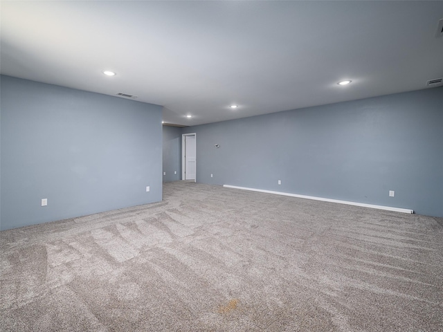carpeted spare room with visible vents and recessed lighting