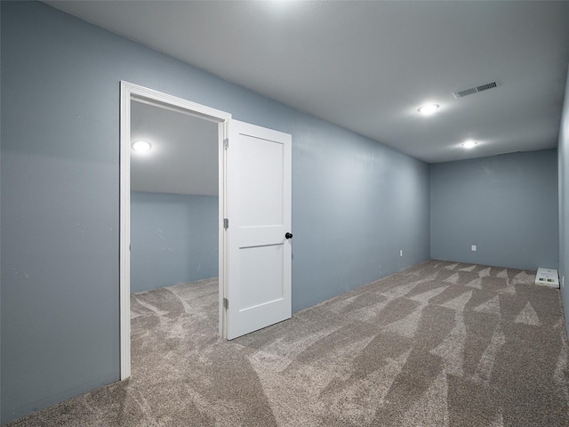 carpeted empty room with visible vents