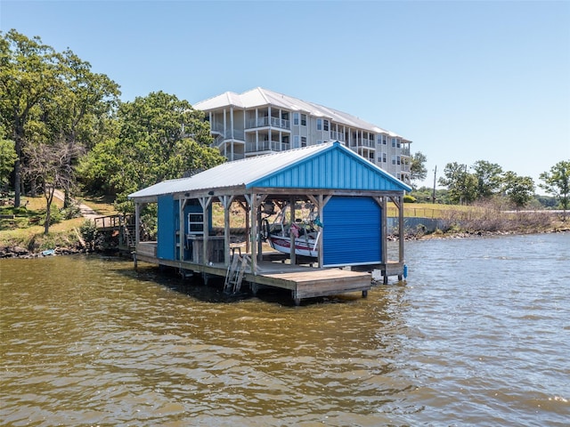 view of dock with boat lift and a water view