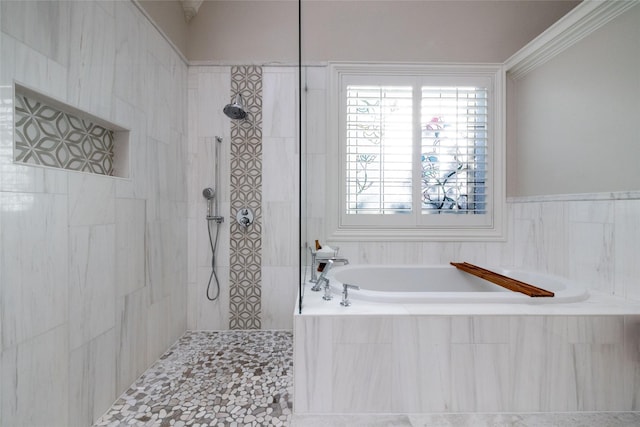 full bathroom featuring a garden tub, crown molding, and a walk in shower