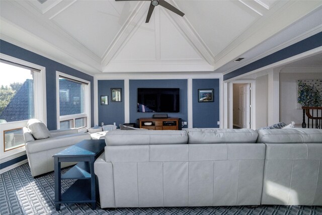 living room featuring visible vents, ornamental molding, a ceiling fan, and vaulted ceiling with beams
