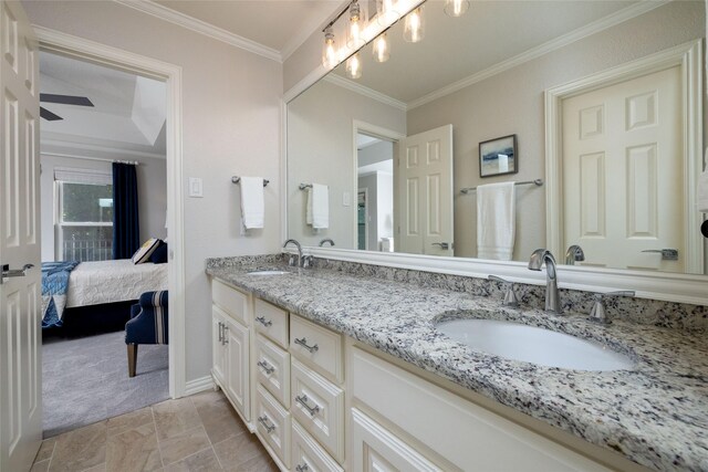ensuite bathroom with ensuite bath, crown molding, double vanity, and a sink