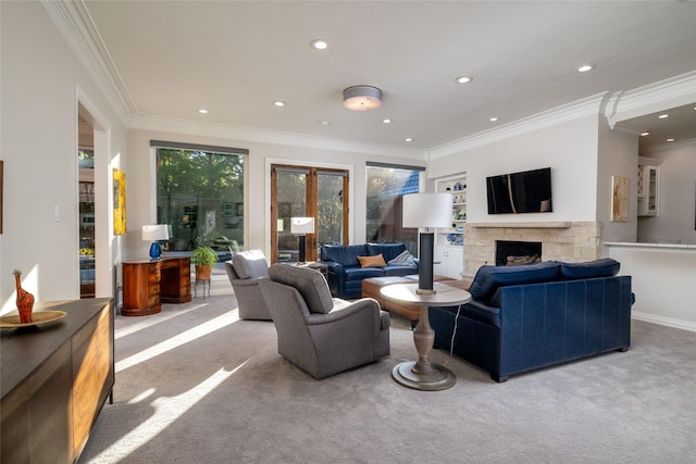 carpeted living room with french doors, recessed lighting, ornamental molding, and a stone fireplace