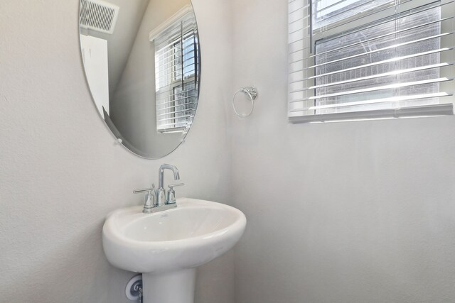 bathroom with a sink and visible vents