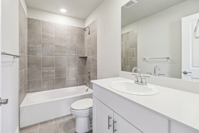 bathroom featuring shower / tub combination, visible vents, toilet, vanity, and tile patterned flooring