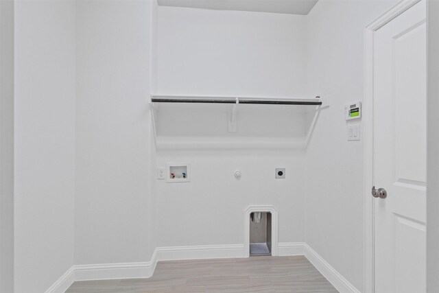 garage featuring a garage door opener and electric panel
