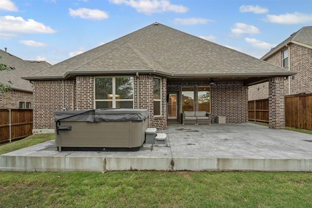 7416 San Jacinto Trl, Mckinney, TX 75071 - back of property featuring a hot tub, brick siding, roof with shingles, and a patio