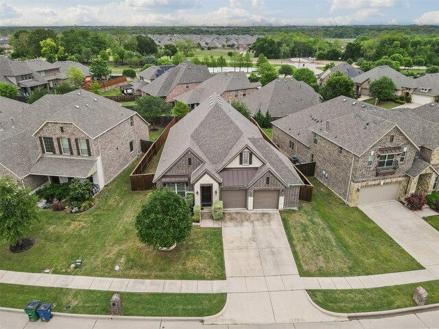 rear view of property with a fenced backyard, brick siding, a hot tub, roof with shingles, and a patio area